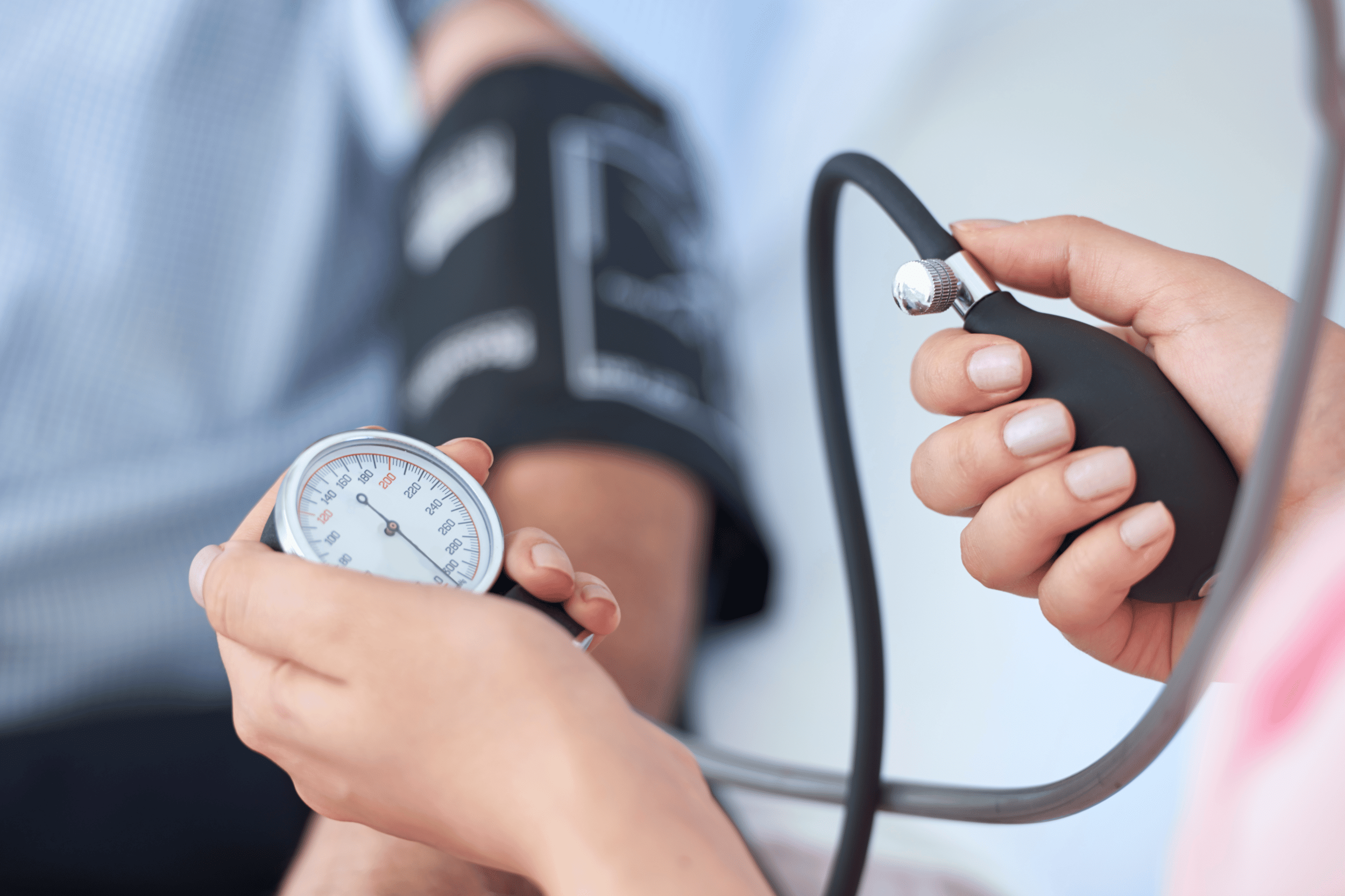 patient getting blood pressure checked by medical professional