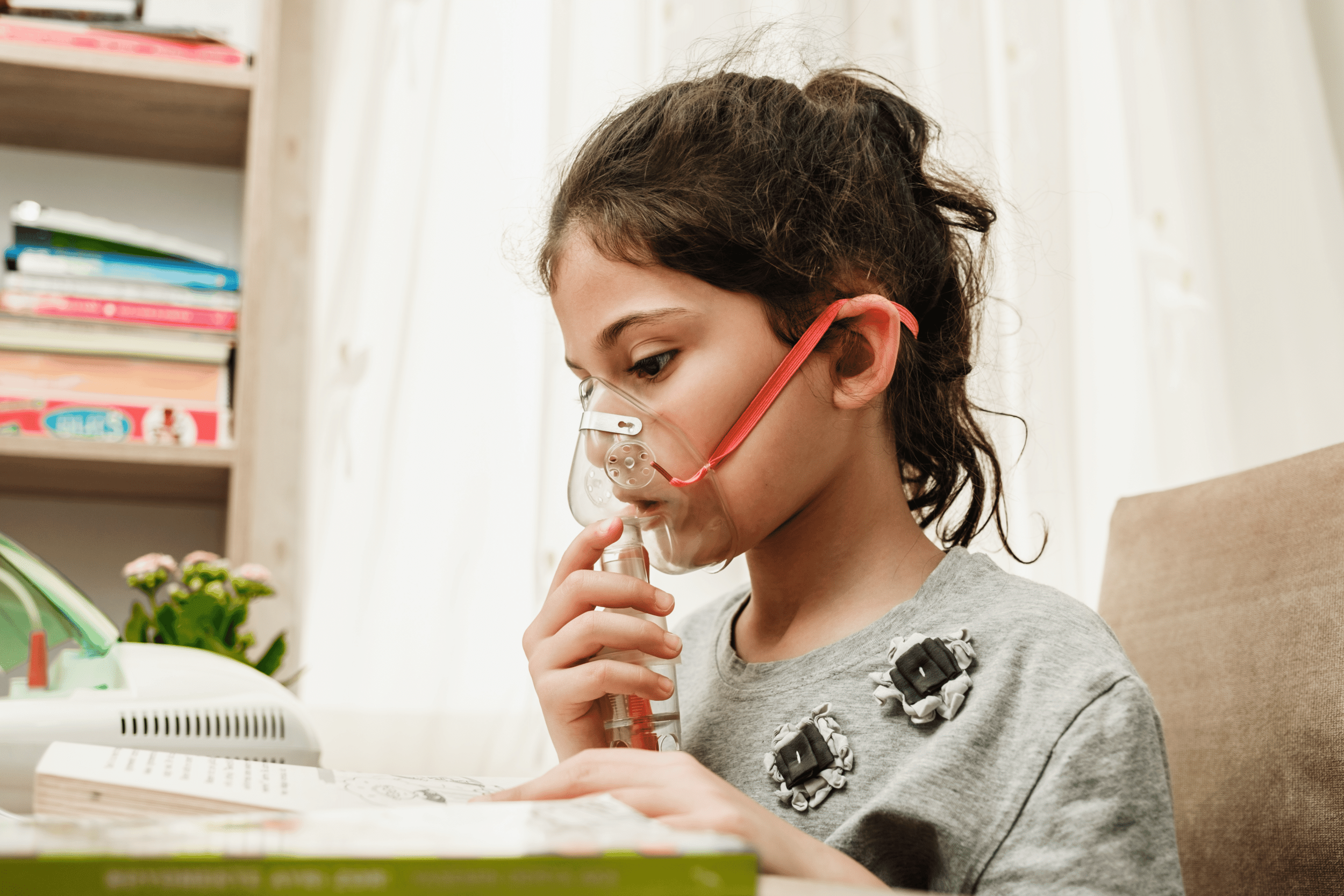 young girl wearing asthma mask